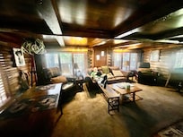 The living room is comfy and good for visiting, watching tv or even getting some work done at the dining table and desk.