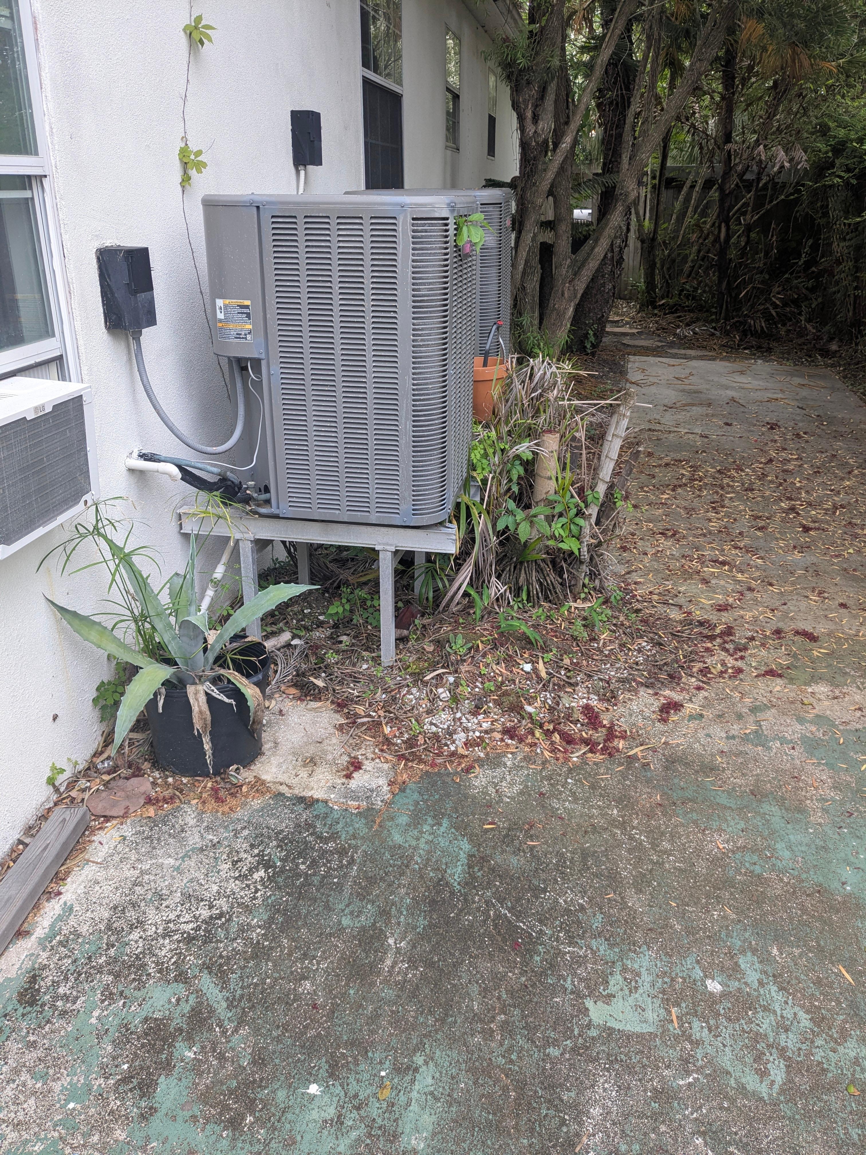 By the trash cans.
