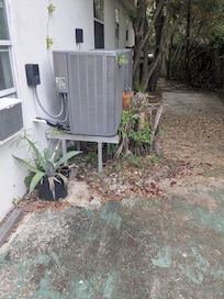 By the trash cans.