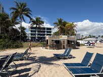 View from private beach. Beach bar, and the pool with poolside bar.