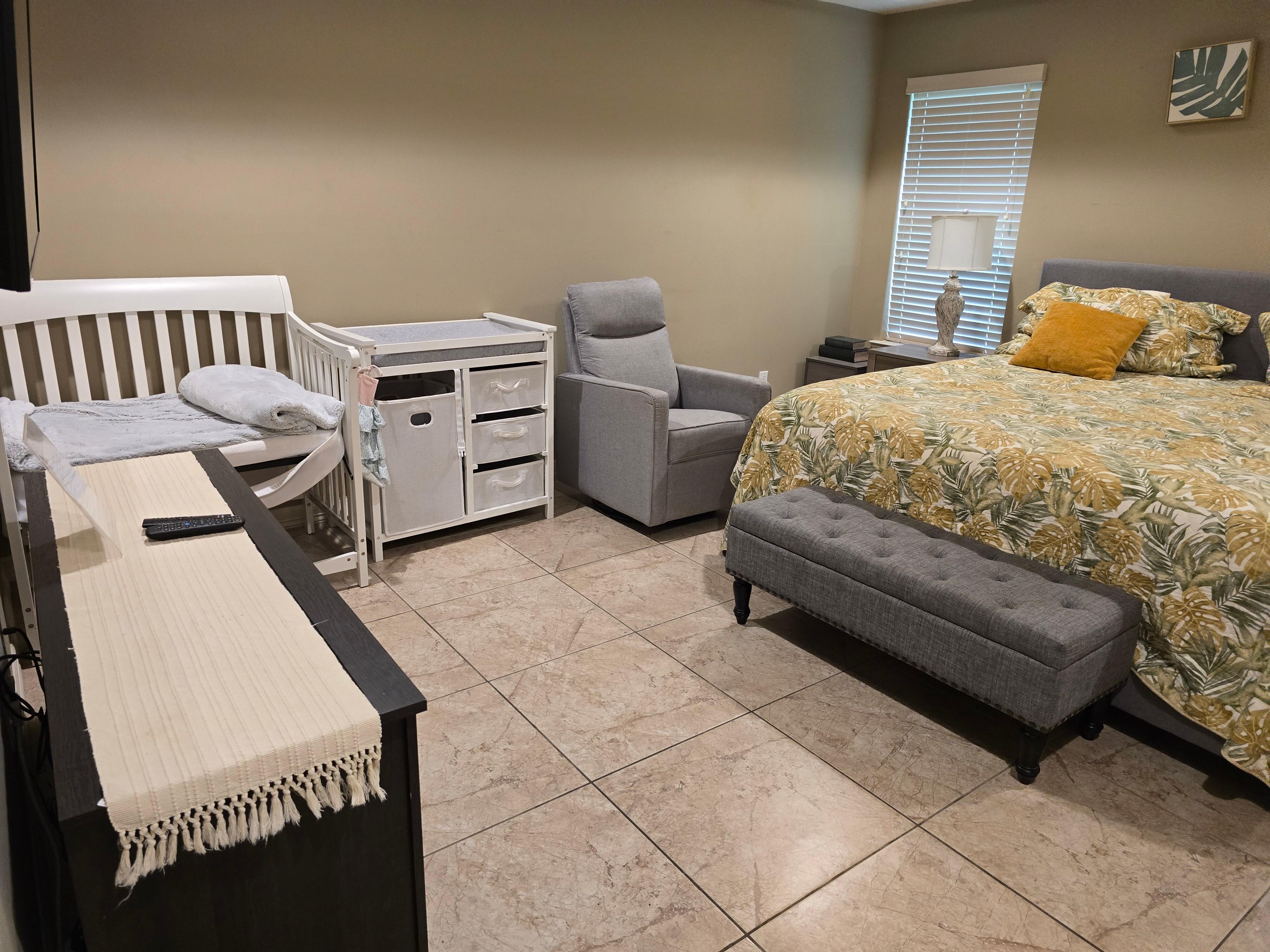 Master bedroom has crib, changing table and rocking chair. Came in handy when came time to  putting baby to sleep 