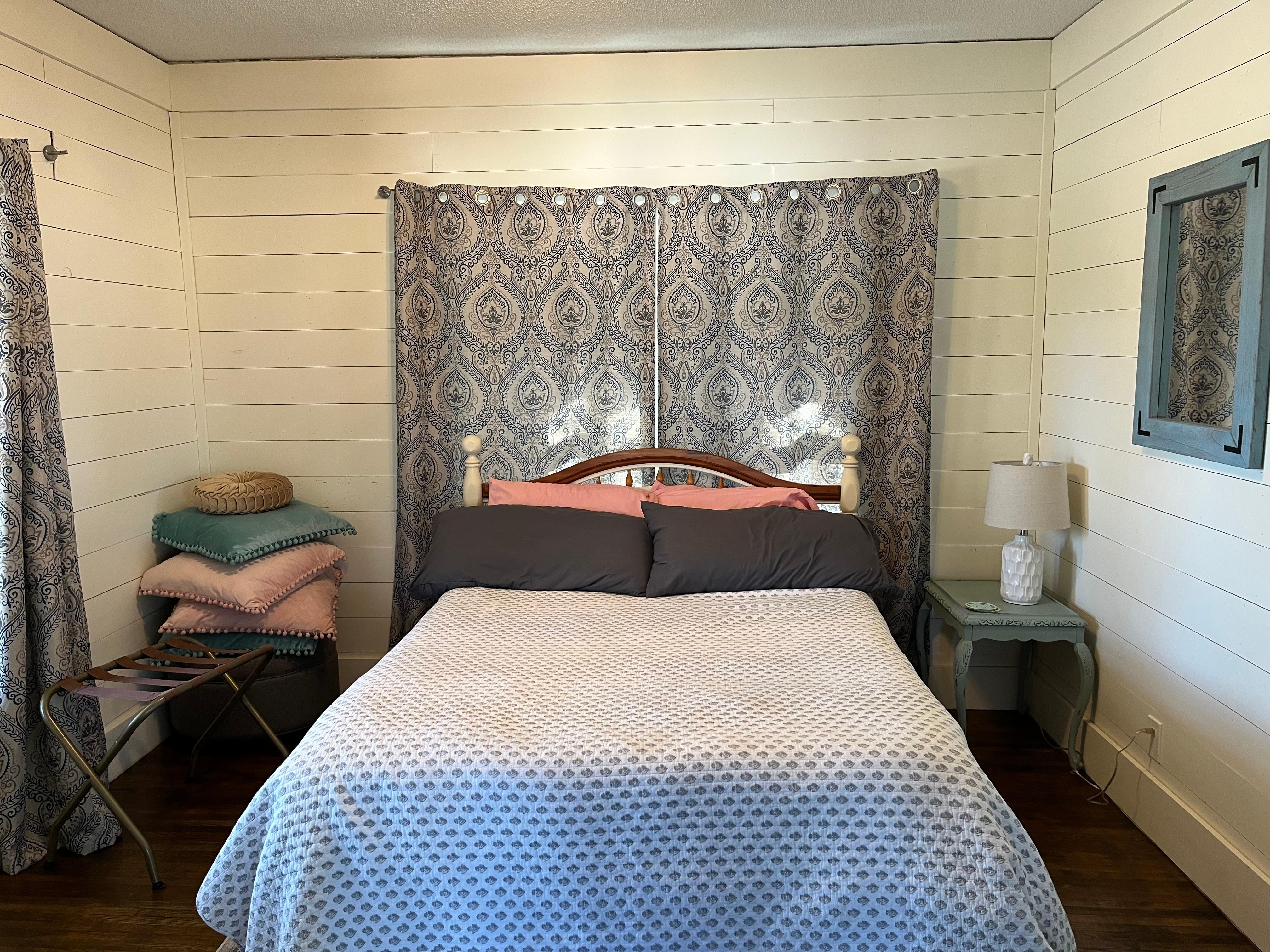 Front bedroom with windows to the front porch