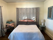 Front bedroom with windows to the front porch