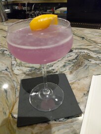 Great cocktail, the P75. Made with empress gin and elderflower, prossecco, and lime