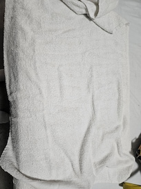 Thin well used towels.