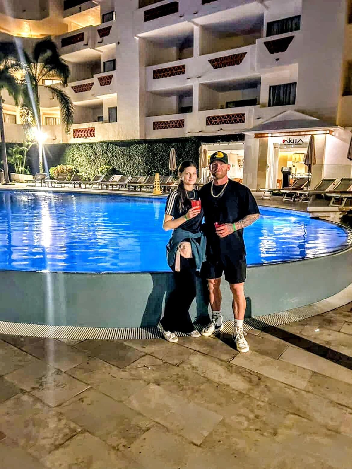 Infinity pool on mountain side with italian and Japanese resturantd behind 