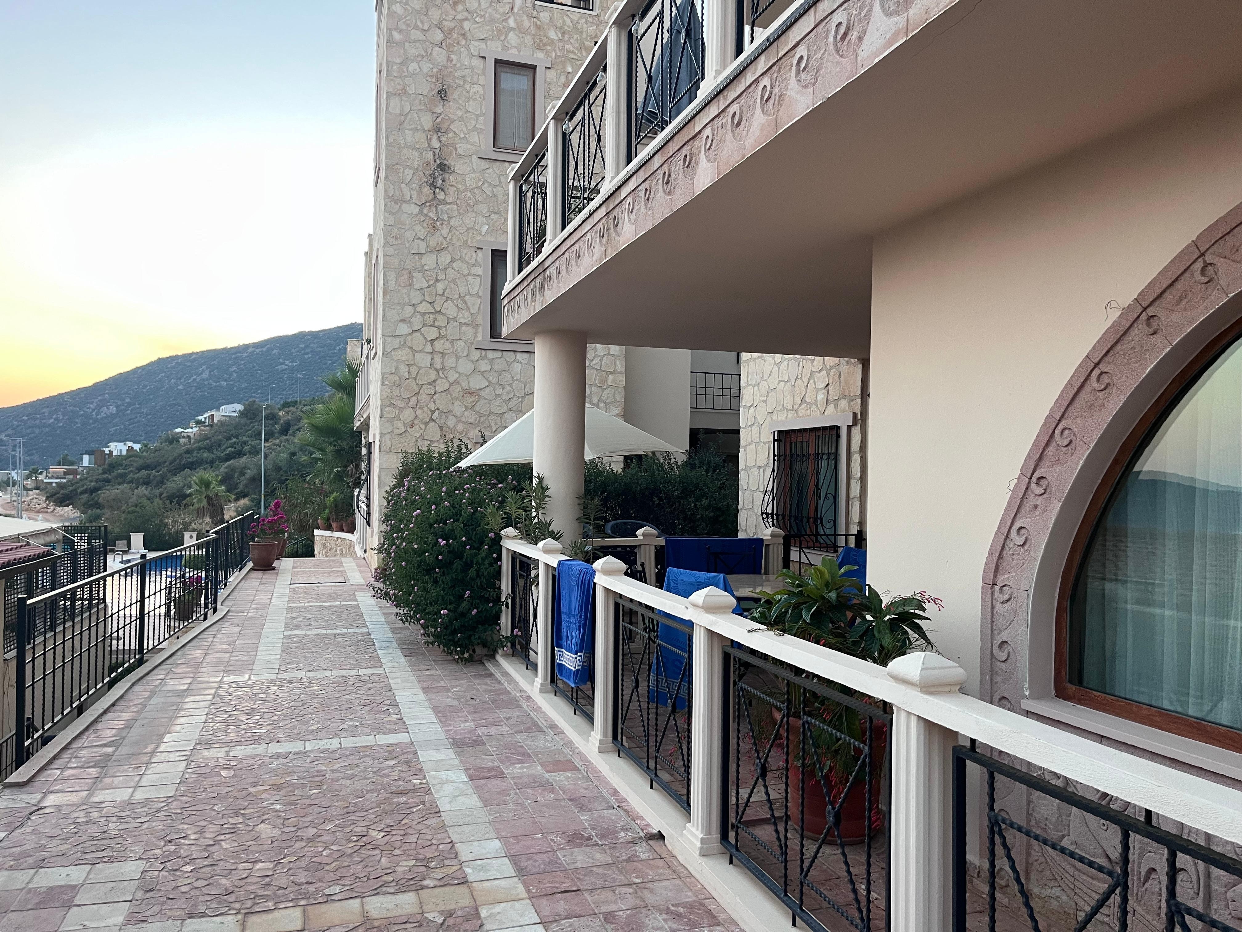 Standing outside the apartment looking towards the pool area