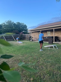 We loved playing cornhole in the backyard.