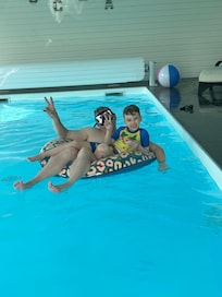 Husband and son in pool