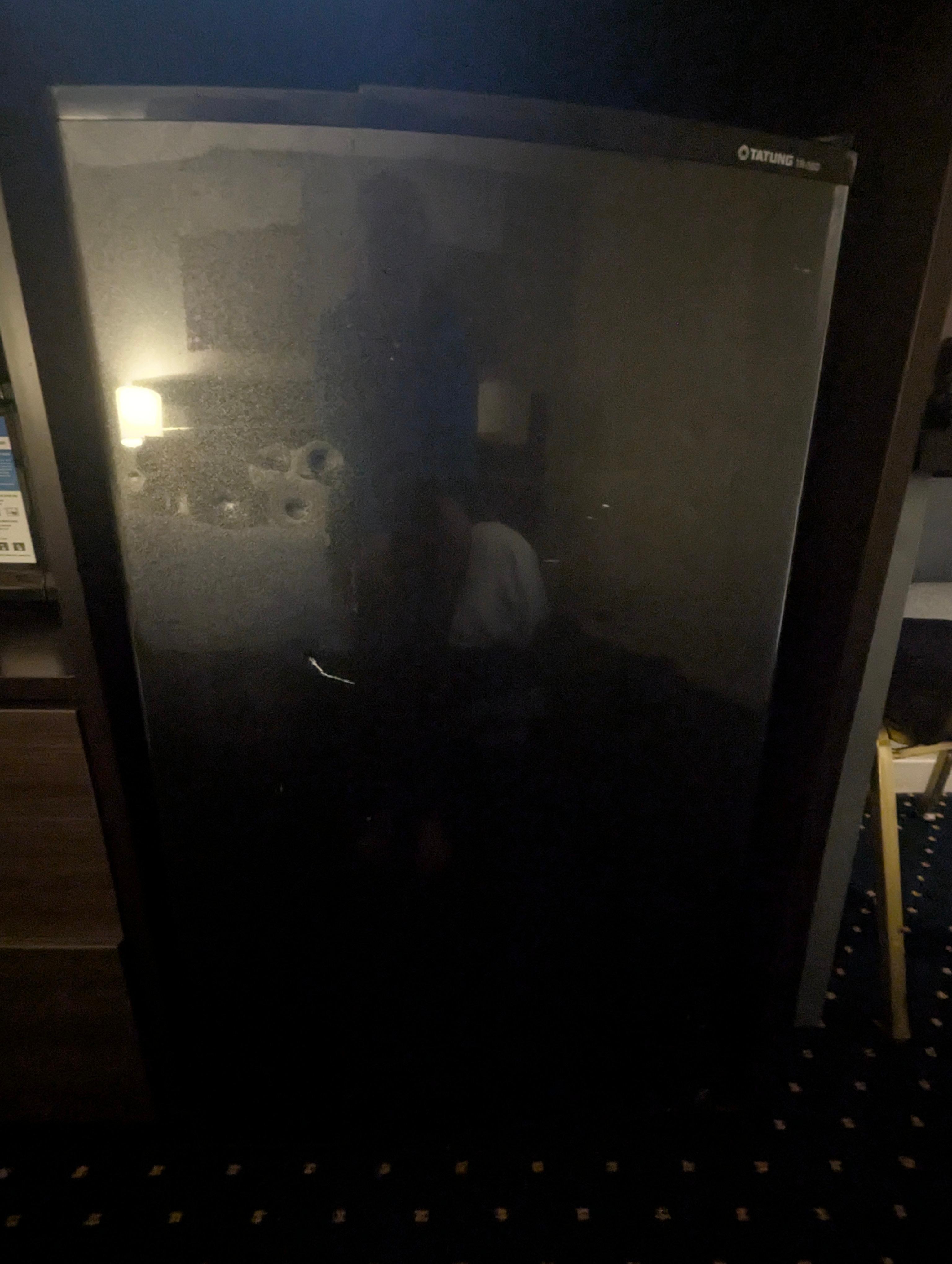 Dented up refrigerator