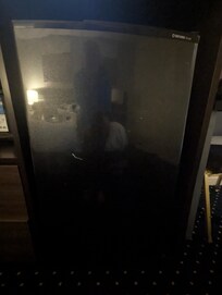 Dented up refrigerator