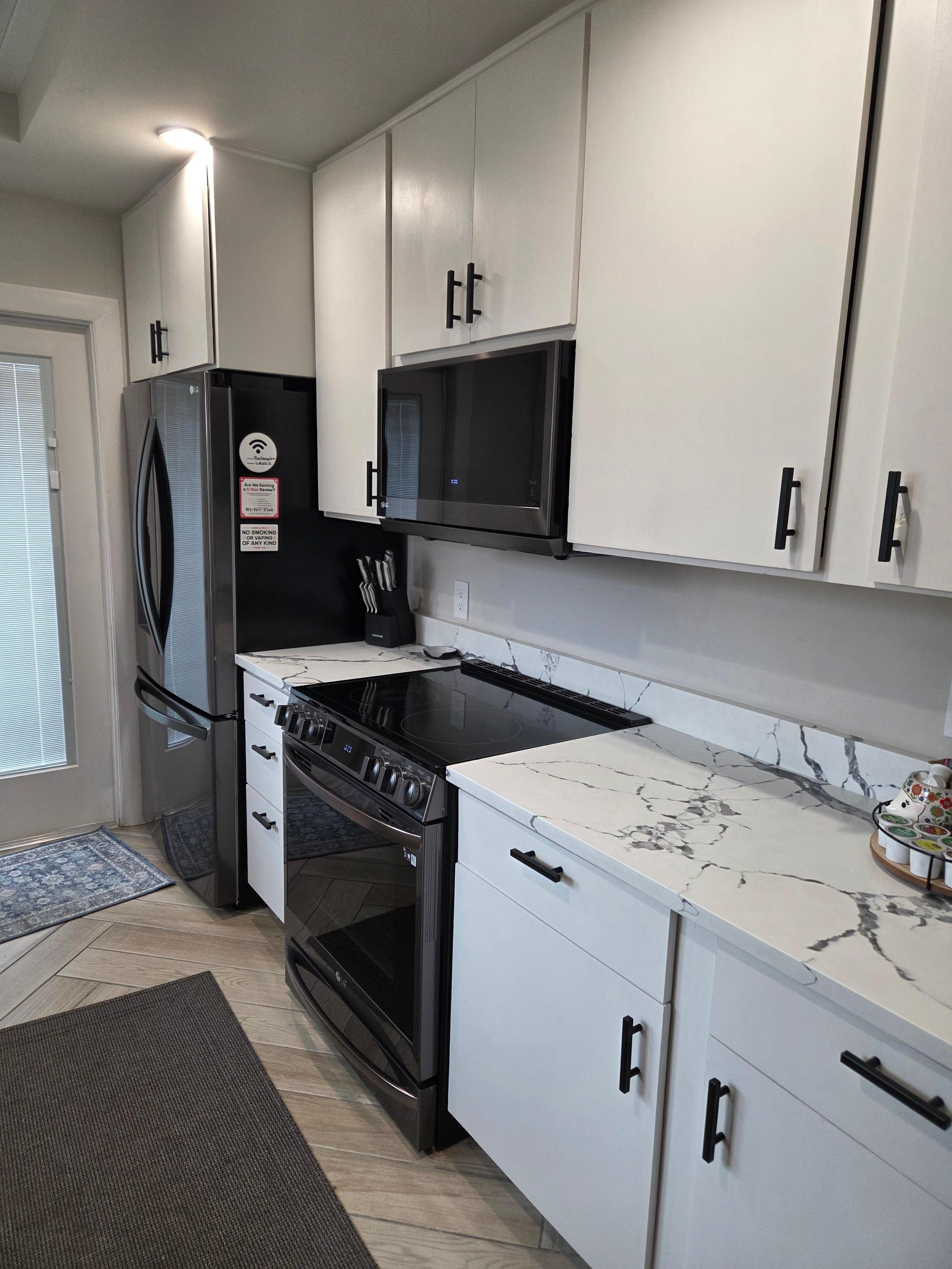 New, very modern appliances. Marble counters. Well stocked kitchen.