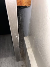 Dust behind the bed