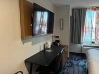 View of desk area and 42 inch (?) TV.