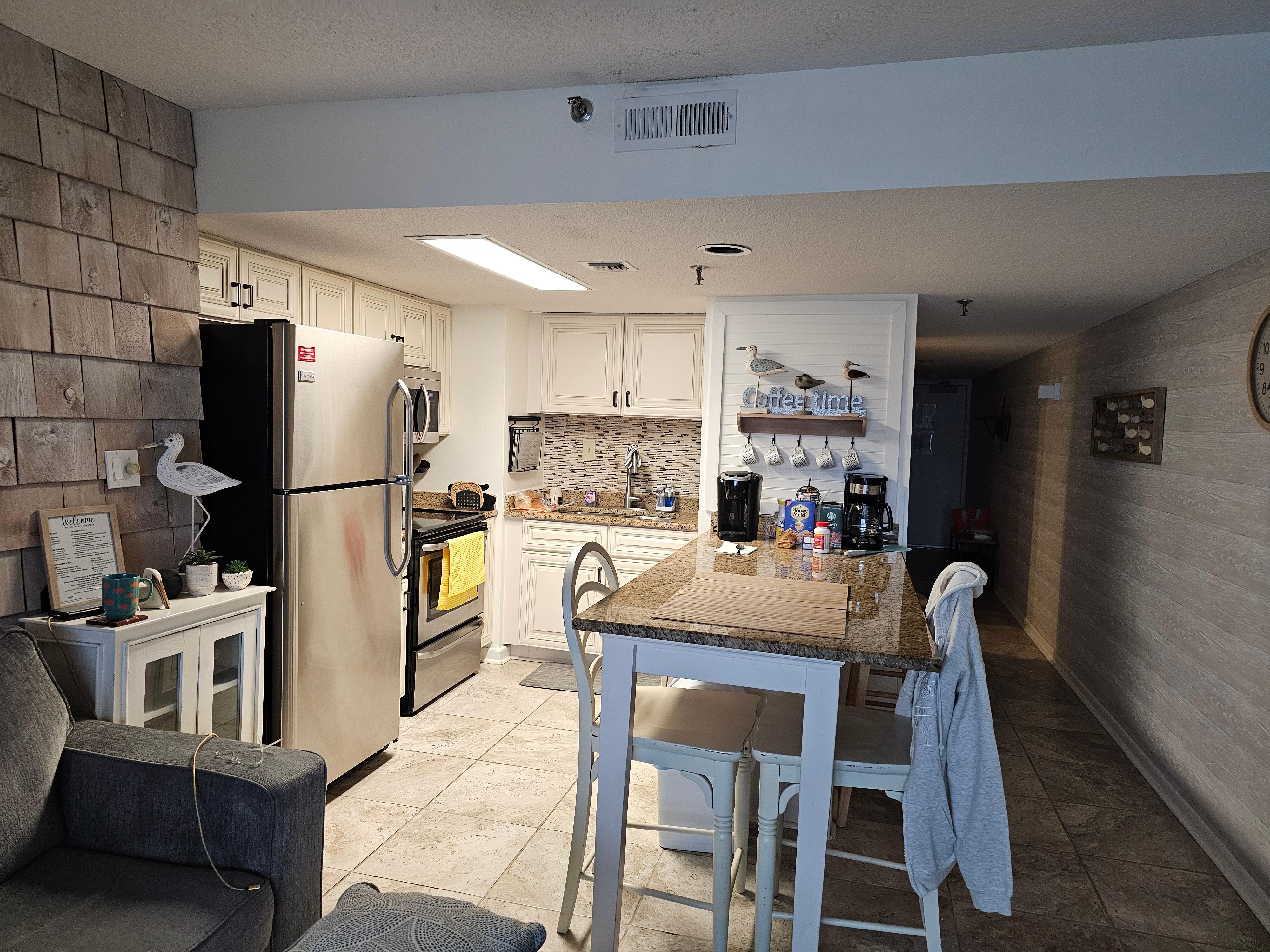 Looking at kitchen from living area. It's easy to cook in.