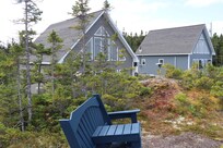 View of the cottage from the bench overlooking the bay