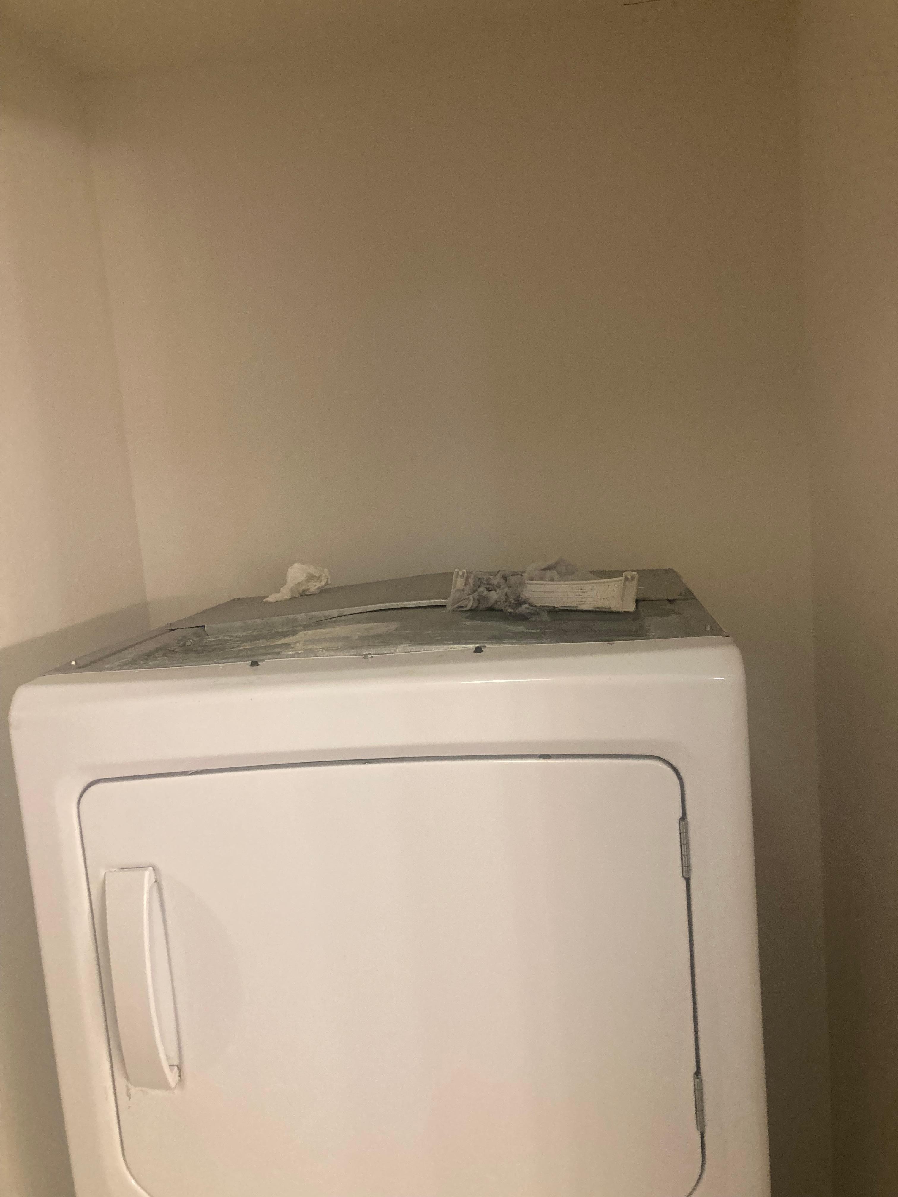 Lint and garbage above the washer and dryer