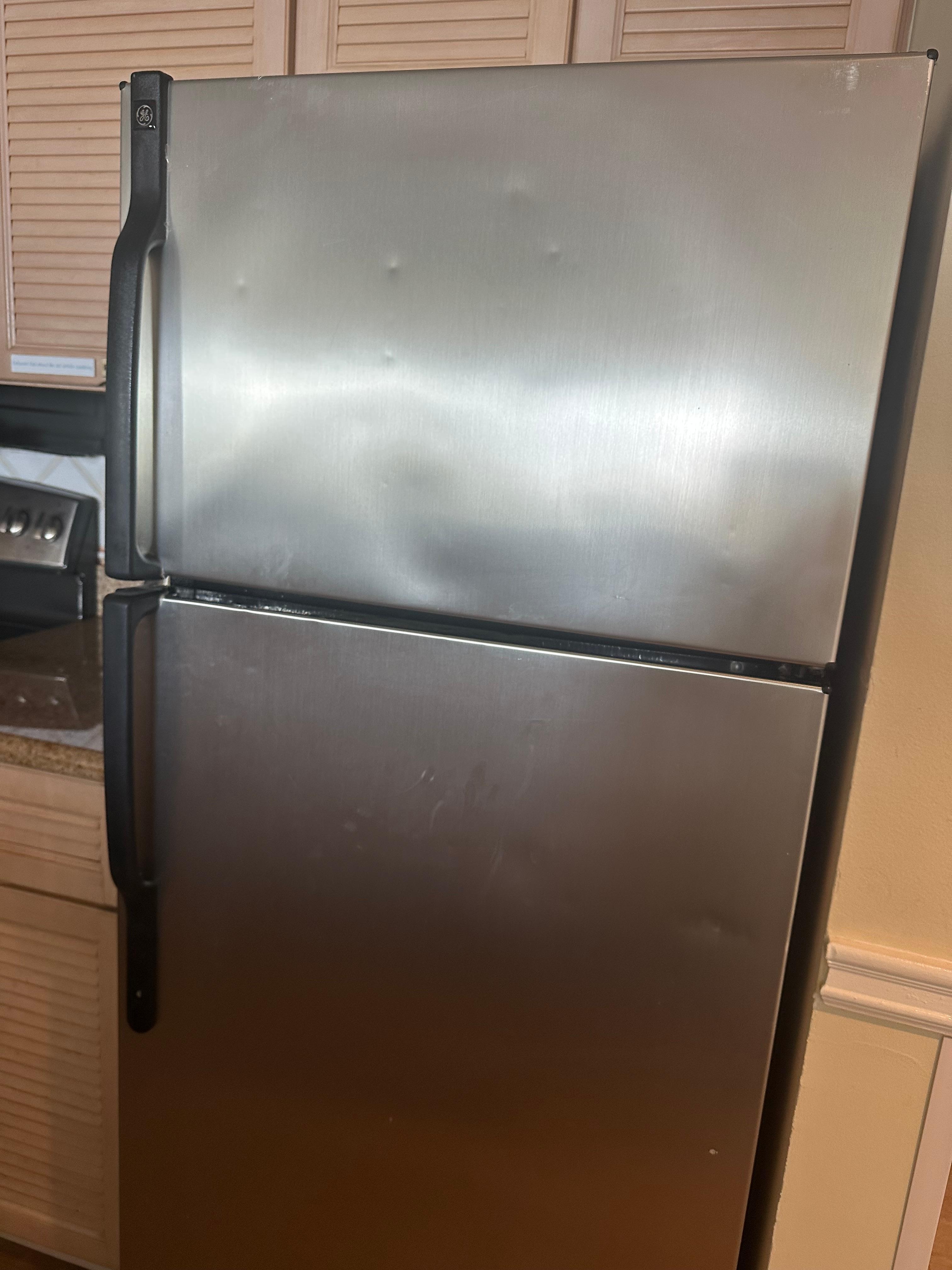 Beat up refrigerator 