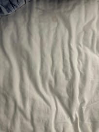 Bed sheet at night with stains from the bites