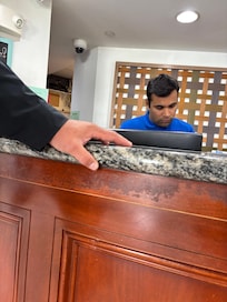 The picture of the receptionist that called himself “Mark” - rude, disrespectful and probably has mental issues. Be careful!