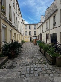 Courtyard to enter the unit smells from the garbage bins and is dark at night.