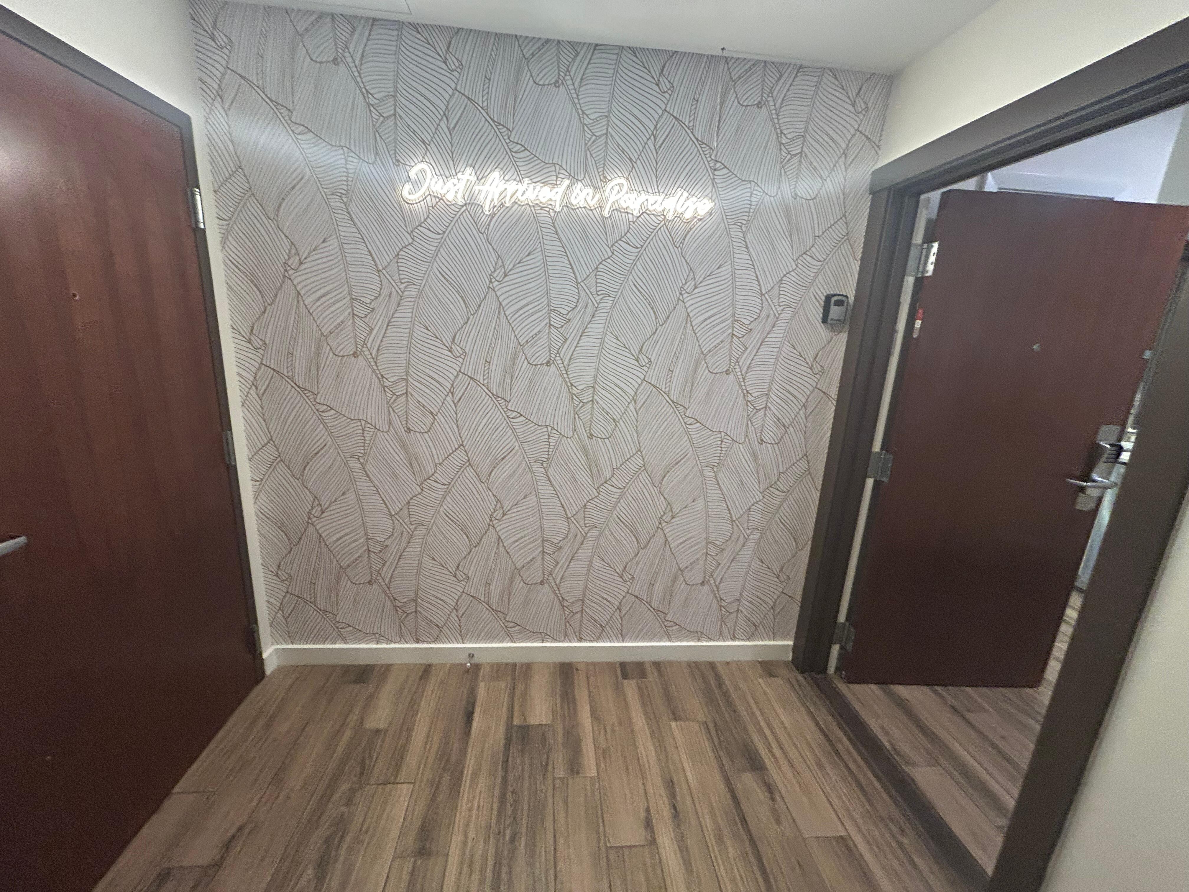 You have your own small private foyer off main hallway. Plus this cute selfie wall. 