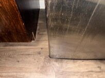 The floor was dirty form the spill on the refrig.