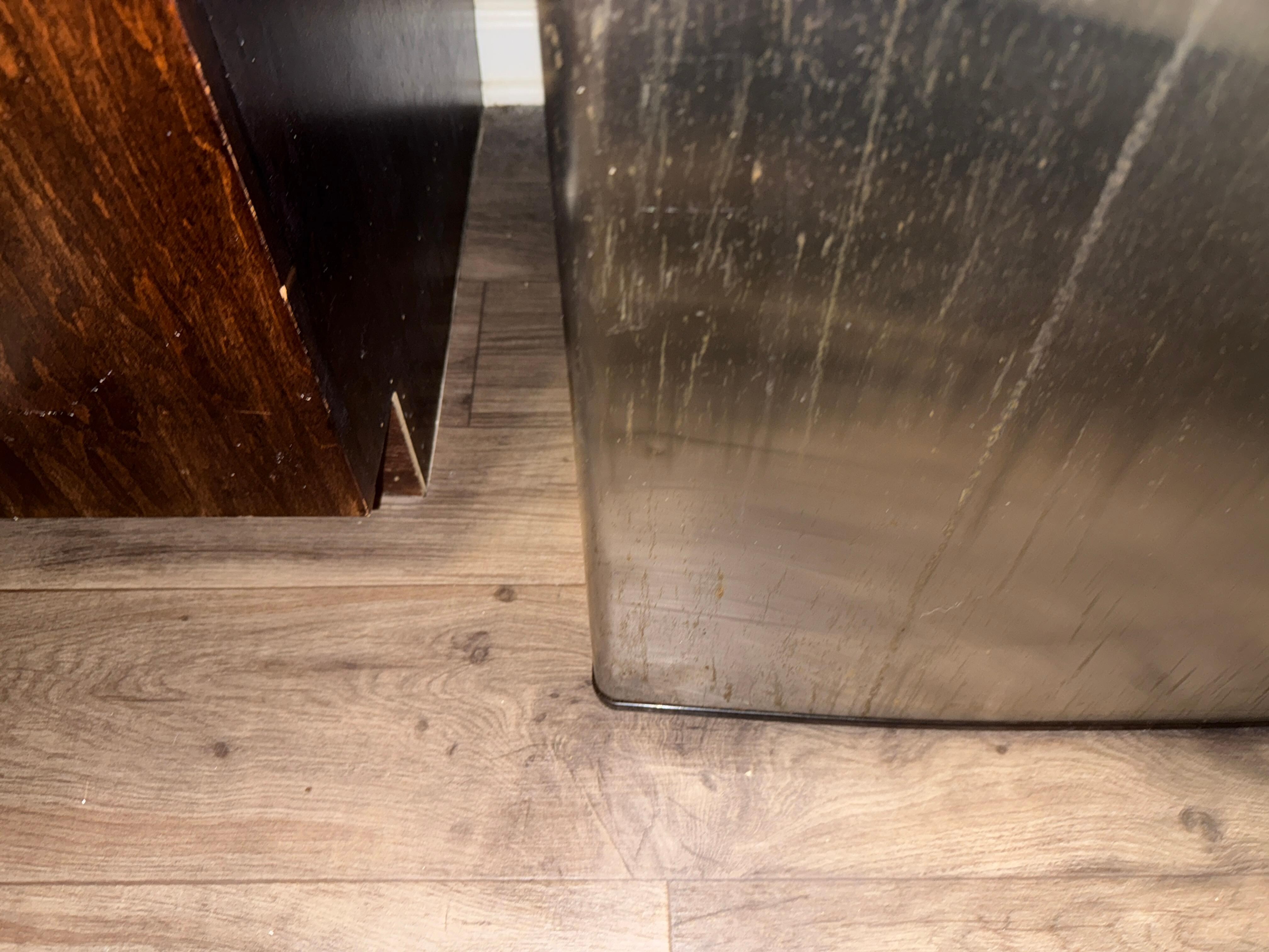 The floor was dirty form the spill on the refrig.