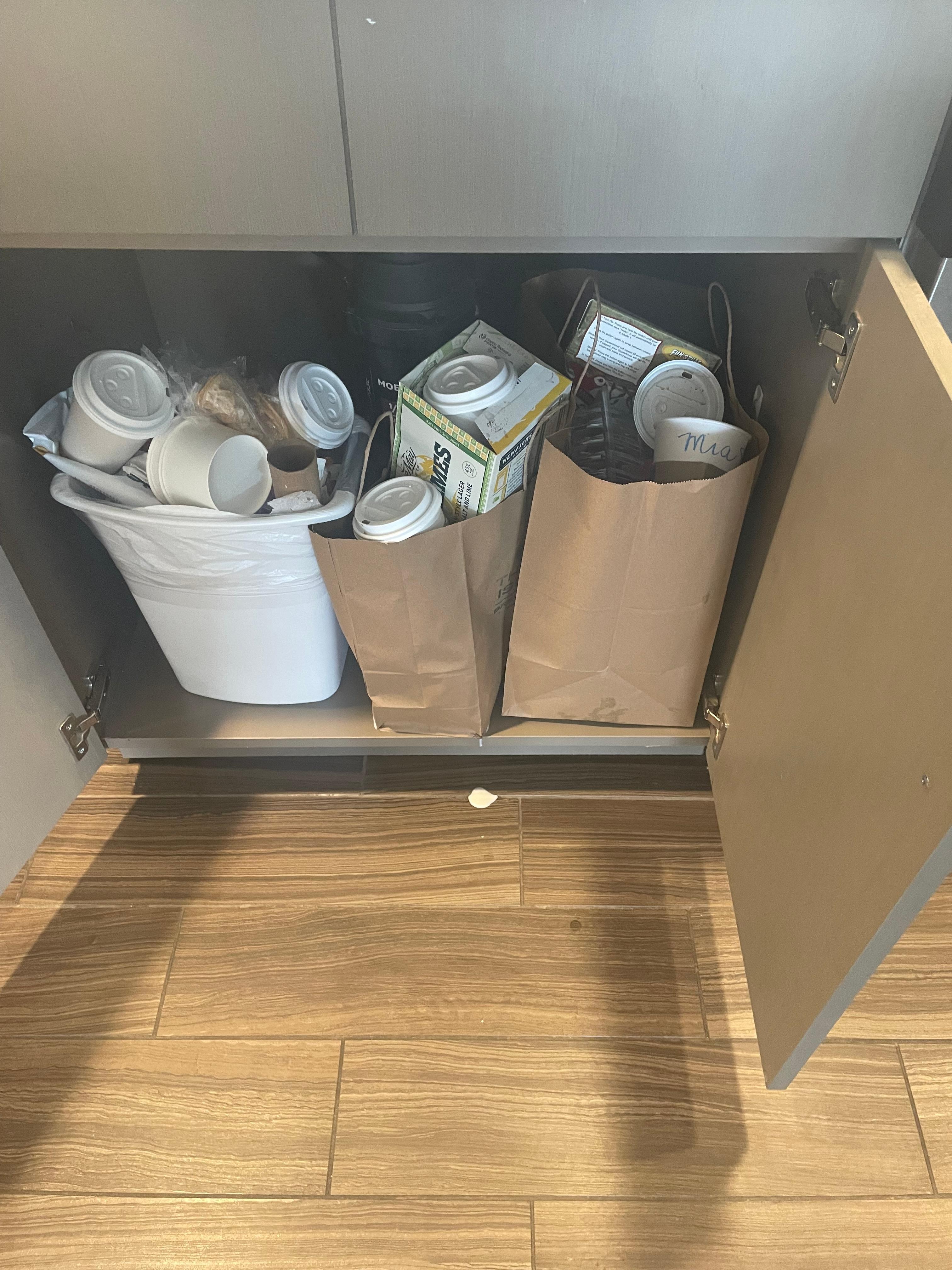 Trash left in room white spot on floor is milk 