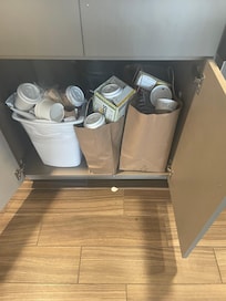 Trash left in room white spot on floor is milk