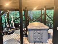 Love the hot tub. On the deck below the cabin