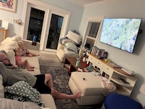 TVâs in every room. A lot of furniture in the family room.