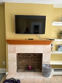 TV is on a swivel arm so can be watched from the bed or the chairs