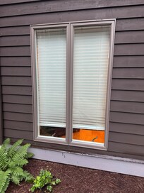 The blind did not cover the window preventing full darkness and privacy.