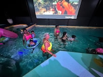 enjoying the pool and projector.