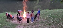 Fire by the river with loving family