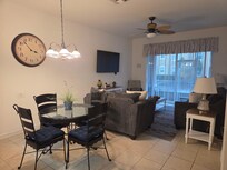 Comfortable living room to watch TV and nice table and chairs for meals. The pass through to the kitchen was handy for clearing dishes.