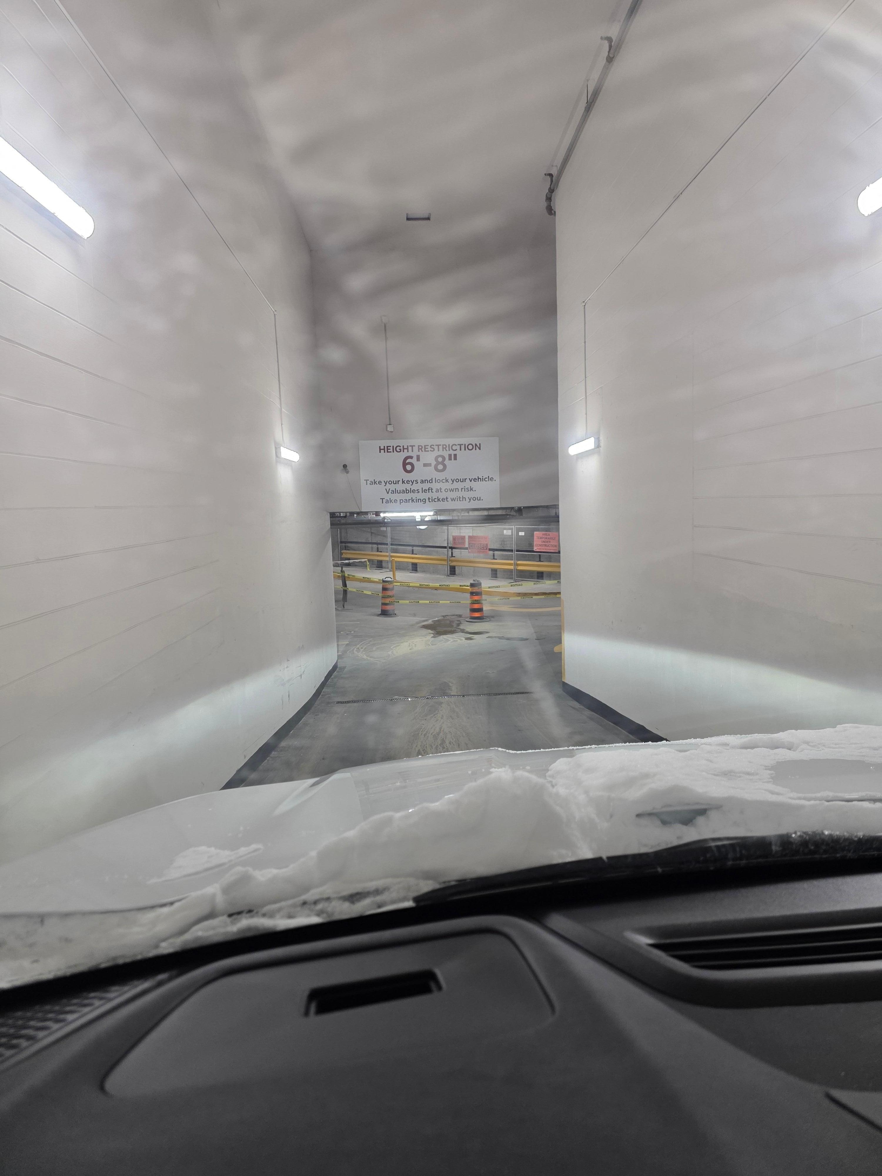 Entry to parking garage is very narrow but widens once down the ramp.