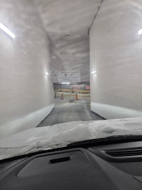 Entry to parking garage is very narrow but widens once down the ramp.