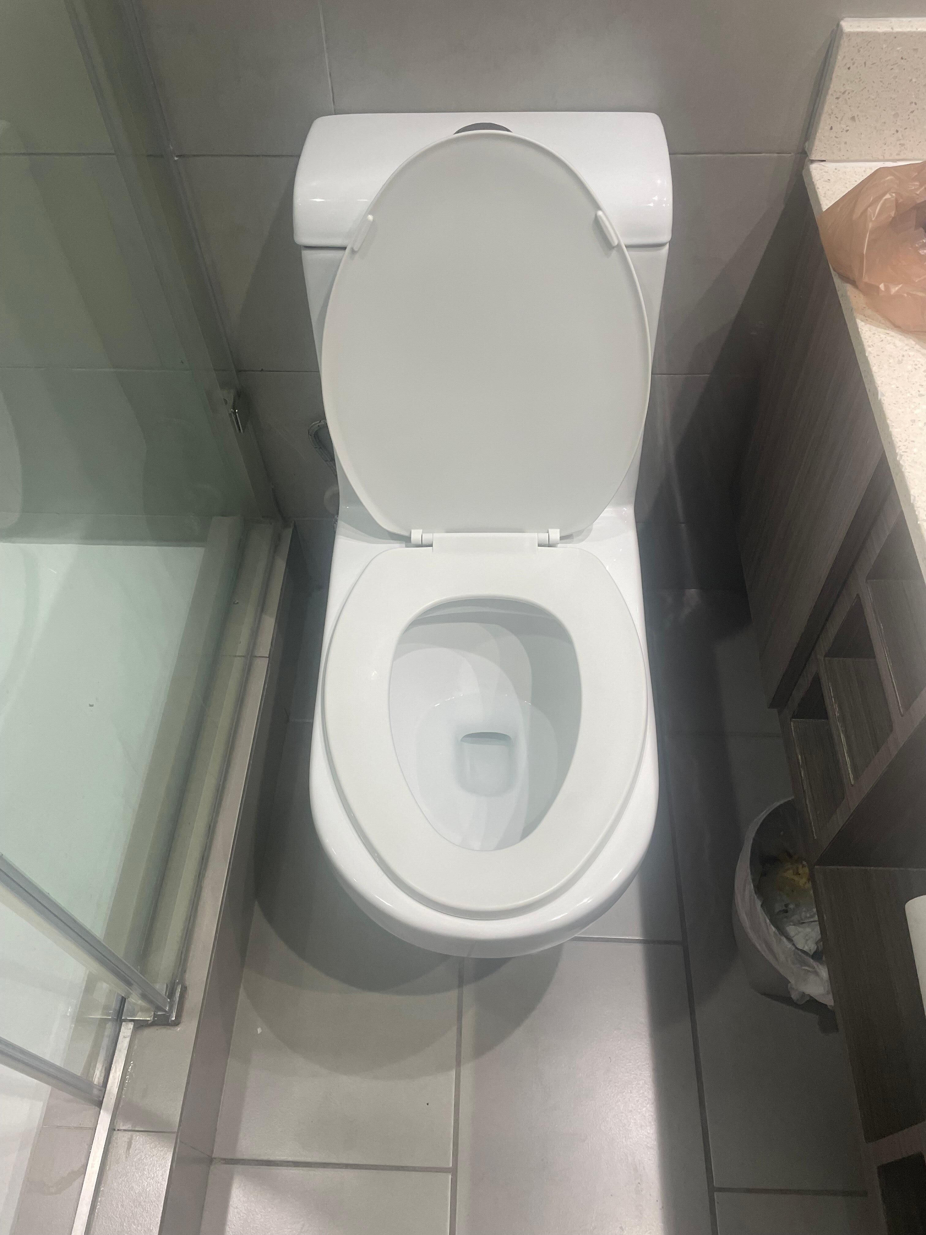 Wrong size toilet seat, hope you don't mind your legs touching the bowl
