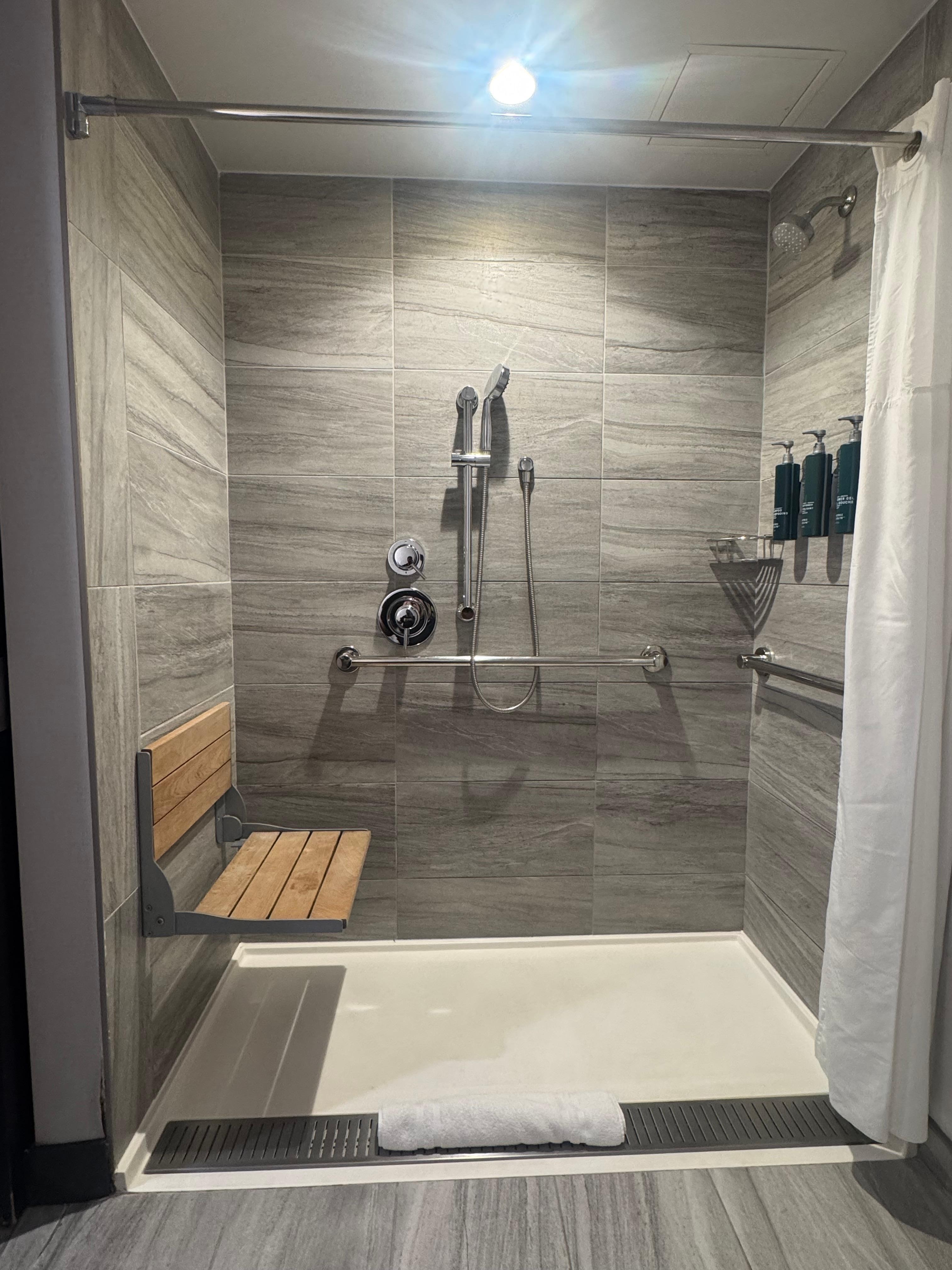 Roll-in shower for access. No threshold 
