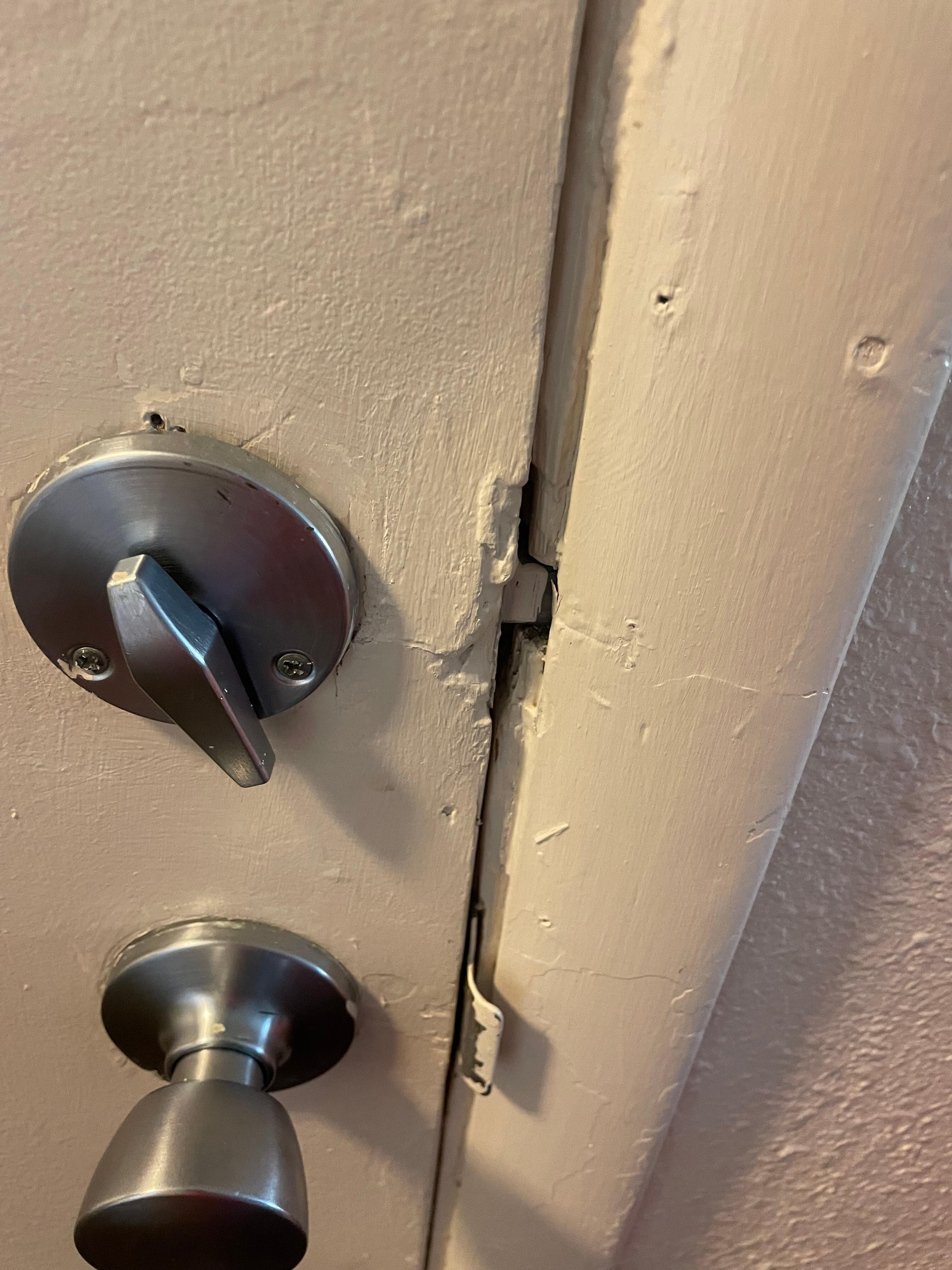 Lock to adjoining room does not look secure. 