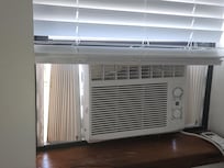 Manually installed window air conditioner