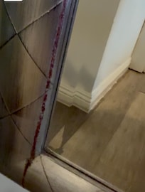 Blood looking stain around mirror.