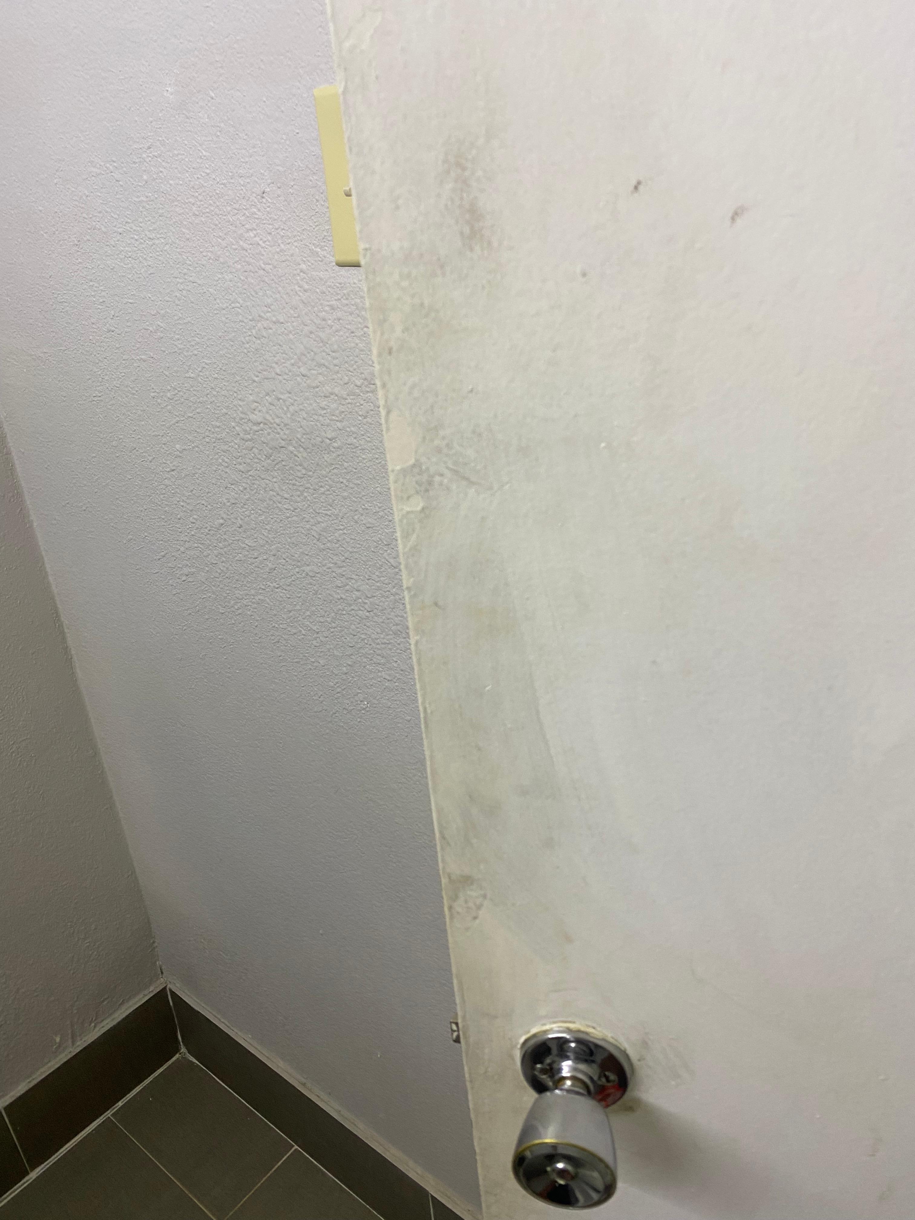 Dirty bathrooms door