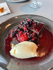 Chocolatey fudgey cake with mixed berries - amazing! In Restaurant Calor