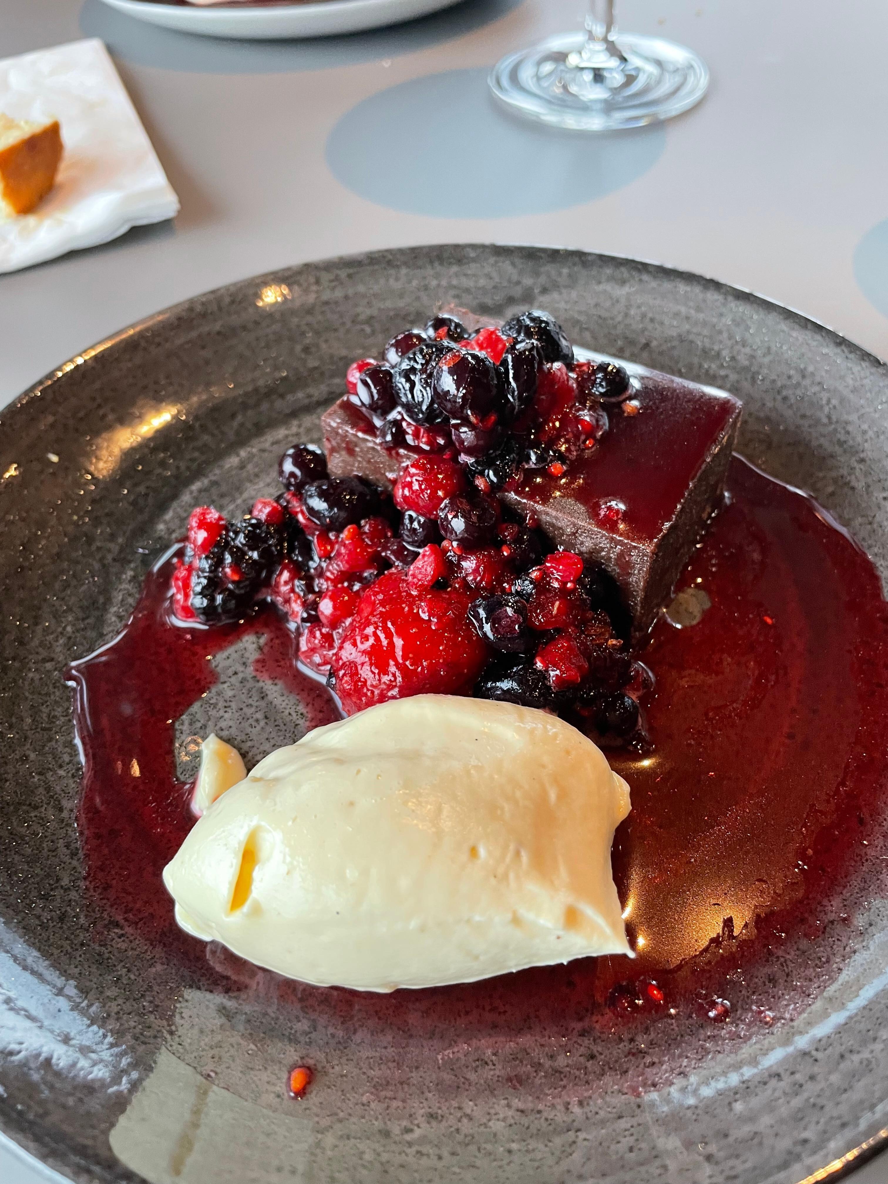 Chocolatey fudgey cake with mixed berries - amazing! In Restaurant Calor