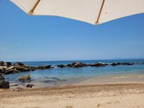beach, private, nice rock jetty, clean, well maintained, they provide chairs and umbrellas.