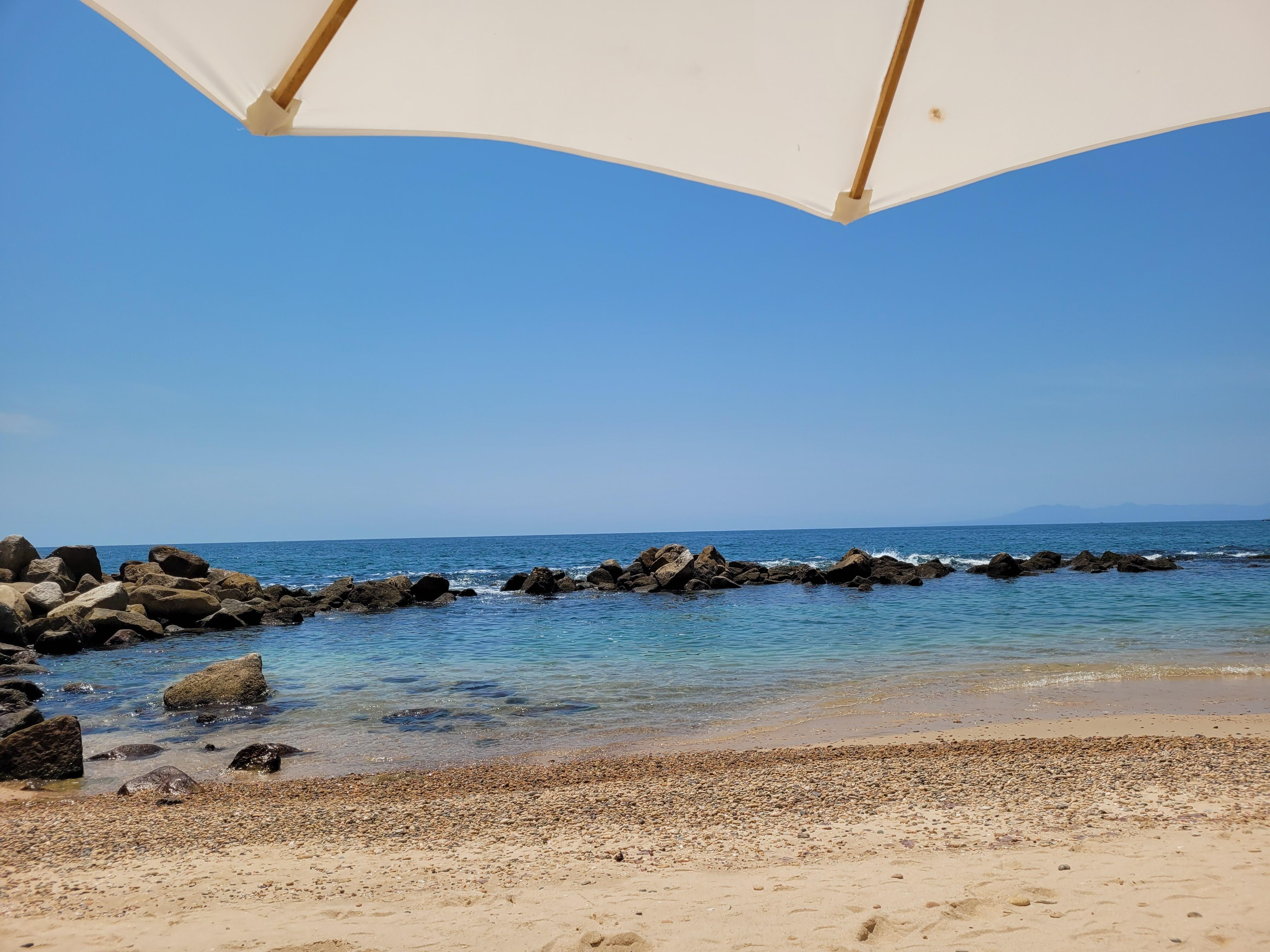 beach, private, nice rock jetty, clean, well maintained, they provide chairs and umbrellas. 