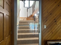 There are 2 ways to access the pool, from the front door hallway (this picture) and a door from the upstairs living room.